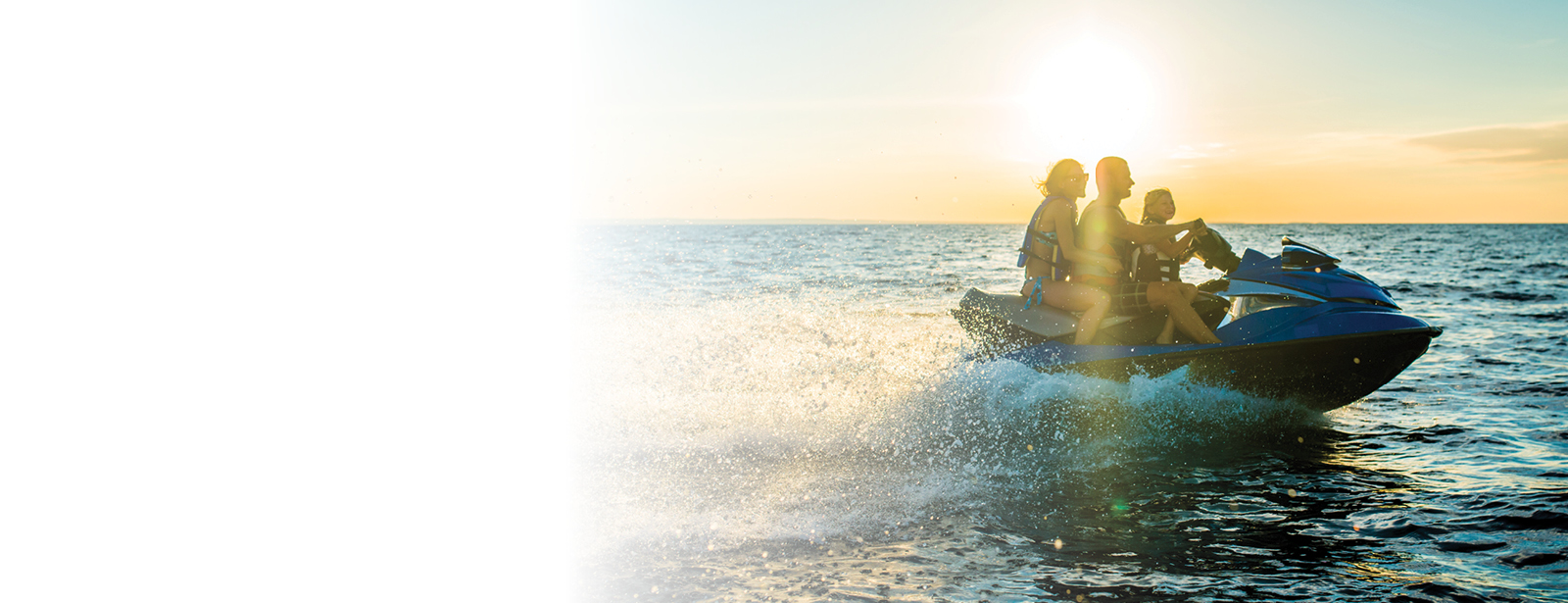 Family riding jet ski.
